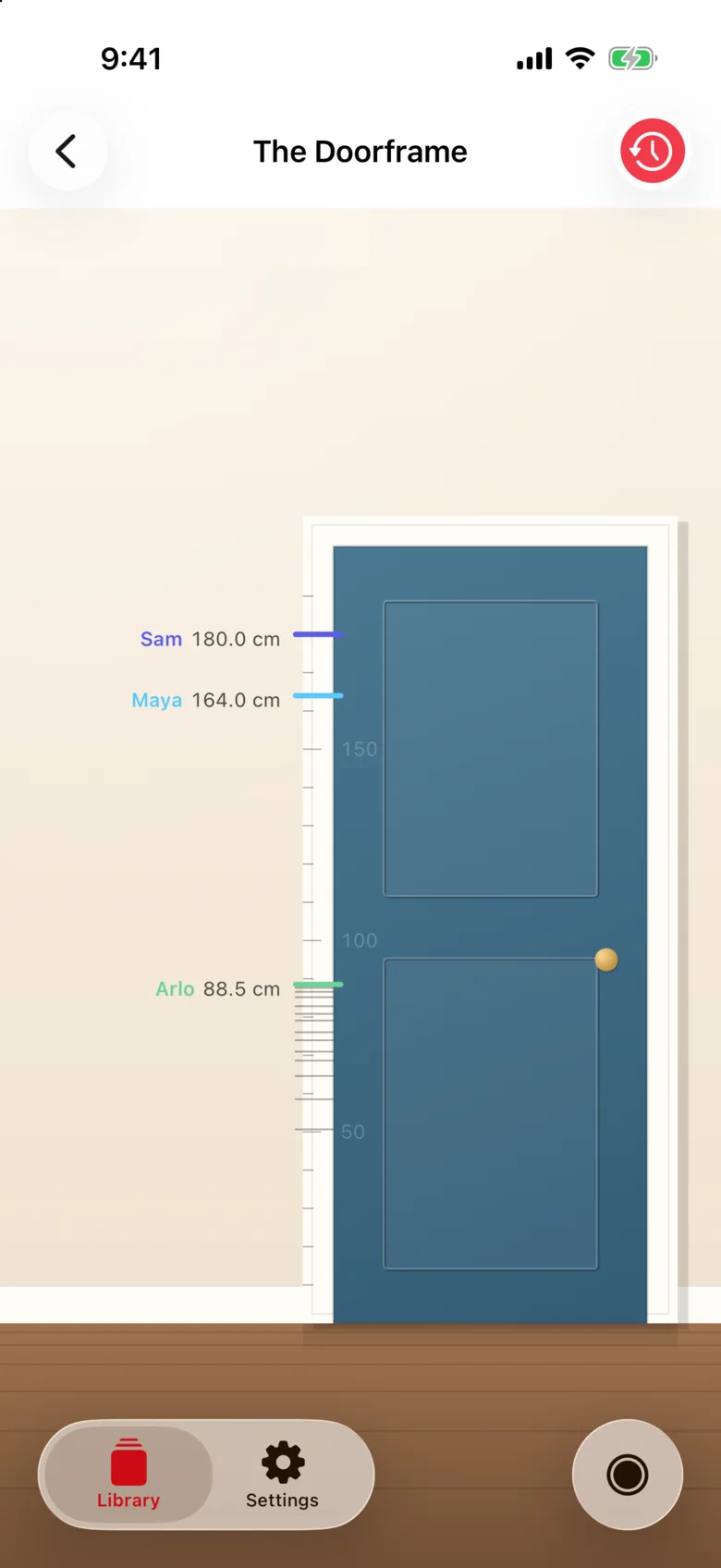 The full Doorframe: a teal door with Sam at 180.0 cm, Maya at 164.0 cm and Arlo at 88.5 cm marked on the casing